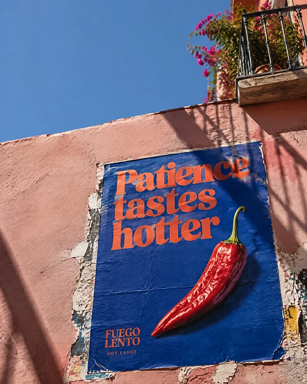 Street poster wall in Mexico City with a bold hot sauce tagline