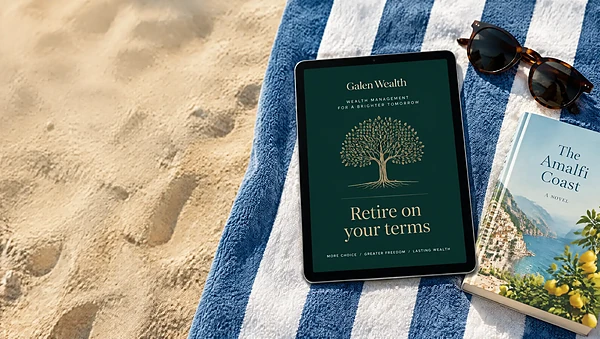 Tablet on a beach towel showing an emerald and gold eBook cover