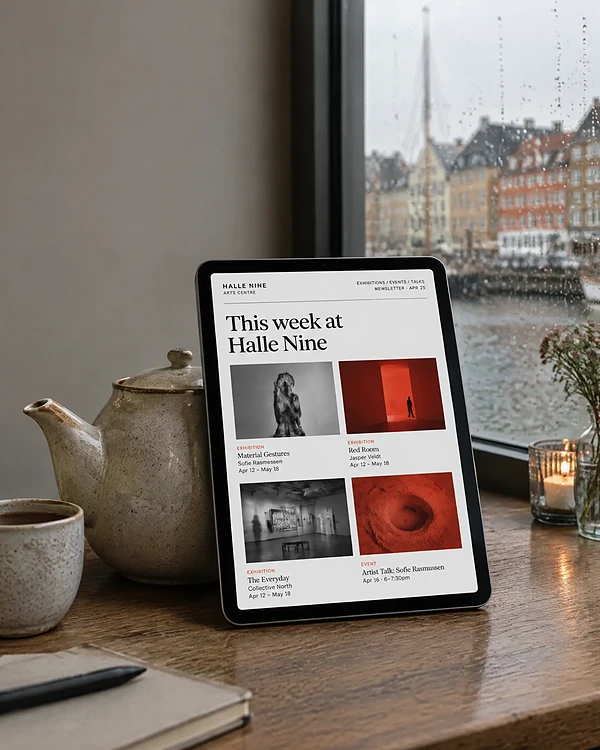 Tablet on a café counter showing an arts centre newsletter
